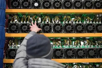 Exterior shot of a large-scale mining farm with solar panels.
