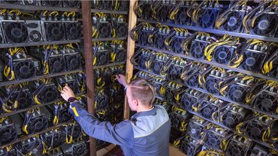 An aerial view of a vast Bitcoin mining farm powered by solar panels, showcasing the integration of renewable energy in the cryptocurrency industry.